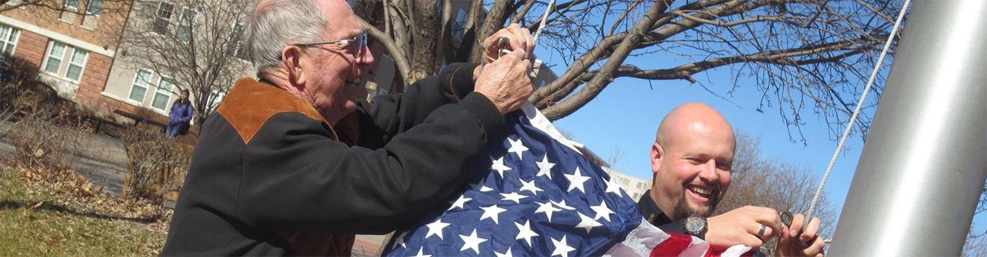 Officer fast hanging american flag